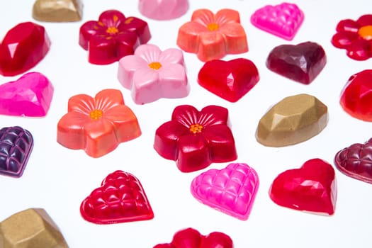 Delicious chocolate candies, close up, different colors.