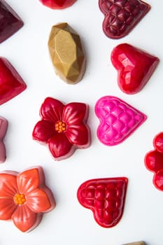 Delicious chocolate candies, close up, different colors.