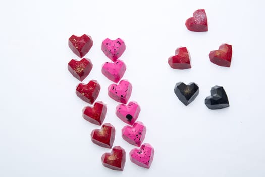 Delicious chocolate candies, close up, different colors.