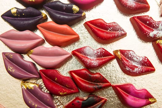 Delicious chocolate candies, close up, different colors.