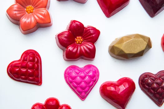 Delicious chocolate candies, close up, different colors.