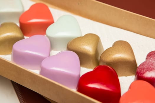 Delicious chocolate candies, close up, different colors.