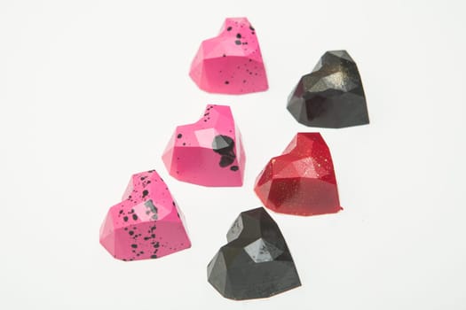 Delicious chocolate candies, close up, different colors.