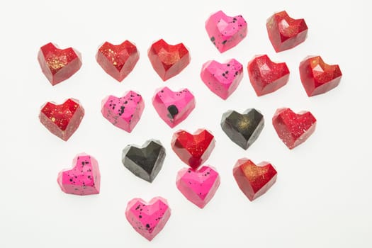 Delicious chocolate candies, close up, different colors.