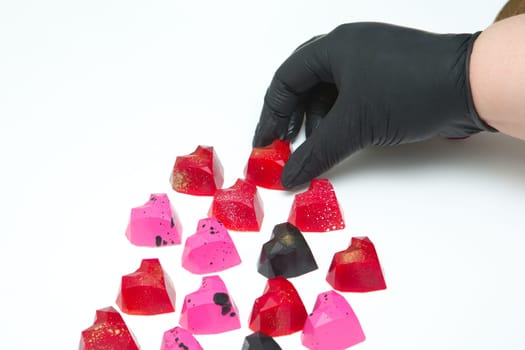 Delicious chocolate candies, close up, different colors.