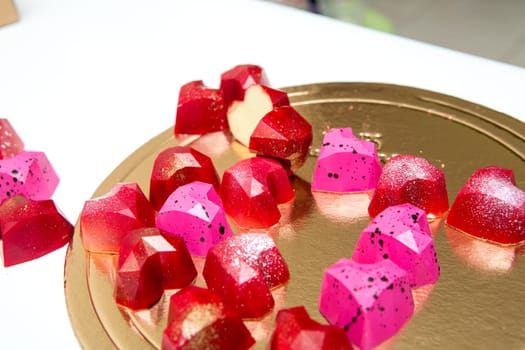 Delicious chocolate candies, close up, different colors.