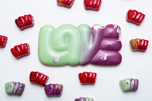 Delicious chocolate candies, close up, different colors.