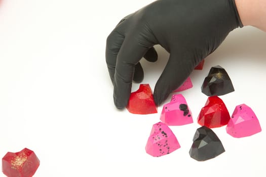 Delicious chocolate candies, close up, different colors.
