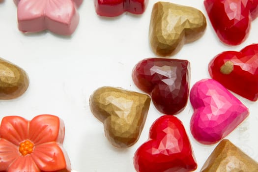 Delicious chocolate candies, close up, different colors.