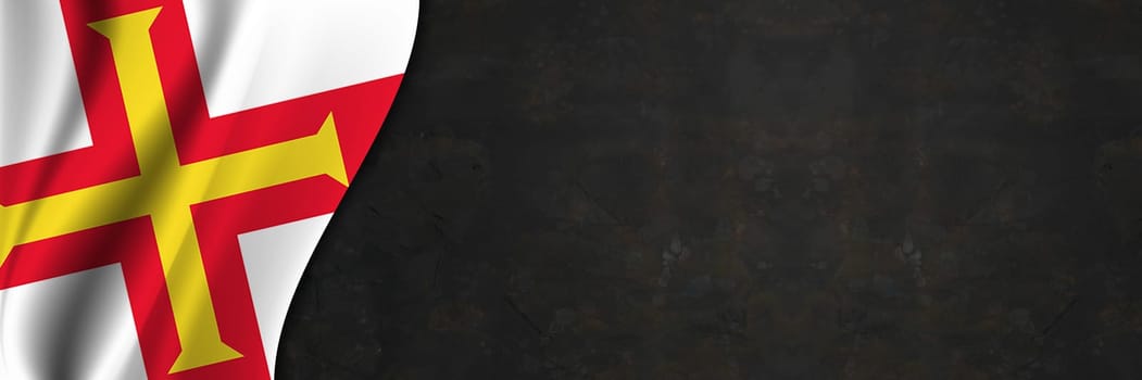 Guernsey flag on concrete wall. Banner with fabric texture of the flag of Guernsey.