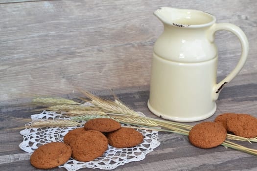 fresh crispy cereal oats cookies and ears on rustic wooden dark table