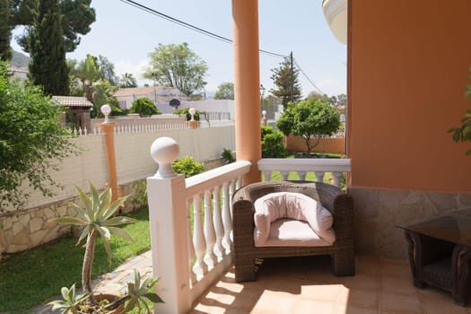 Terraces railing with sea view, blue sky and floral background