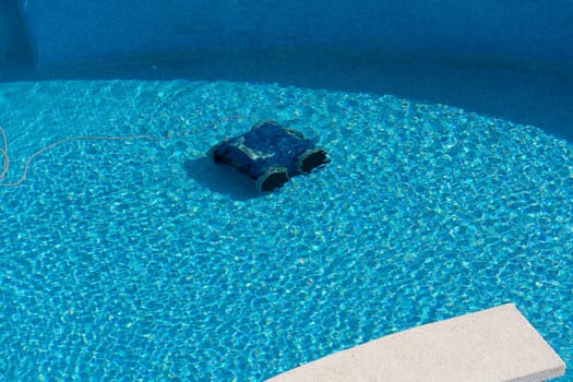 Automatic robot cleans the swimming pool underwater