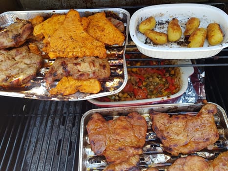 Grilled vegetables and meat on a barbecue grill , top view