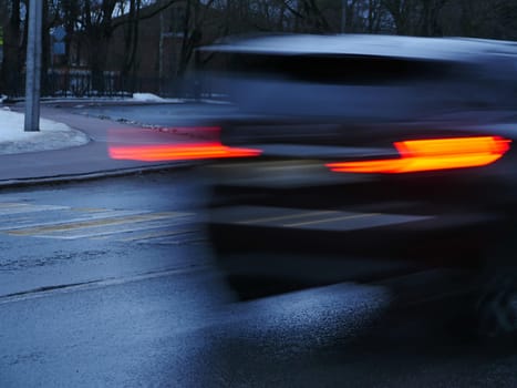 red traffic lights car blurred motion close-up
