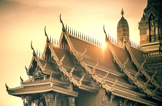 Roofs in Thai architecture kind of temple palace over sunset or sunrise. Building religion in Thailand