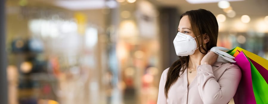Customer In Fashion Store Wearing FFP2 Face Mask