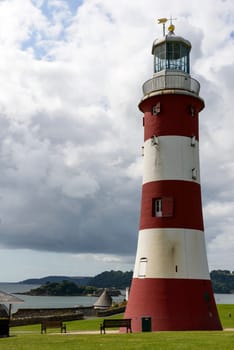 view of old light house at historic location in sea town of southern England.