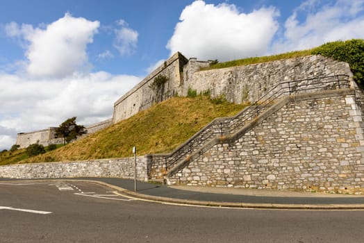 view of the fortifications that enclose the area of the castle in historic sea town of Devon.