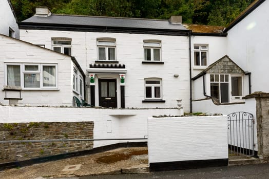 view of old house  in a street of the touristic village on southern coast of Cornwall.