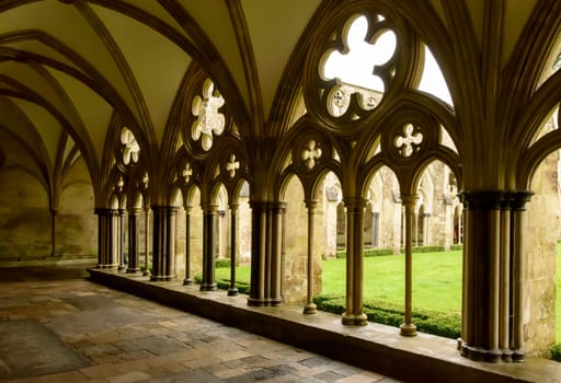 foreshortening of mullions and decoration of large cloister alongside famous Gothic church.