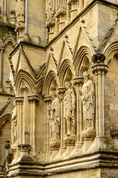 detail of highly decorated stone facade of famous Gothic church.