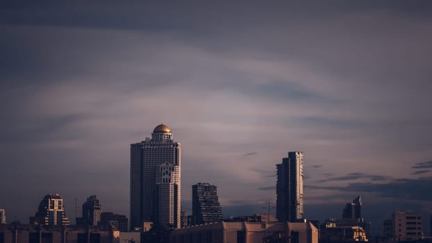 Aerial view of Bangkok modern office highrise buildings, condominium in Bangkok city downtown with sunset sky , Bangkok , Thailand