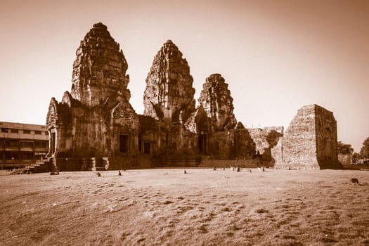 Phra Prang Sam Yod  historical tourist spot in old town . Monkeys lives with ruins in Lopburi, Thailand. Religious buildings constructed by the ancient Khmer art. Asia destination of tourist