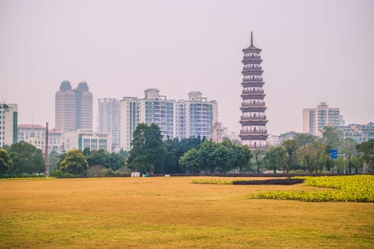 December 2019 Guangzhou China landscape urban design in city with scenic of high-rise building and main tourist attraction named The Temple of the Six Banyan Trees or Liurong Temple .
