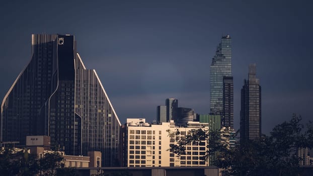 Aerial view of Bangkok modern office highrise buildings, condominium in Bangkok city downtown with sunset sky , Bangkok , Thailand