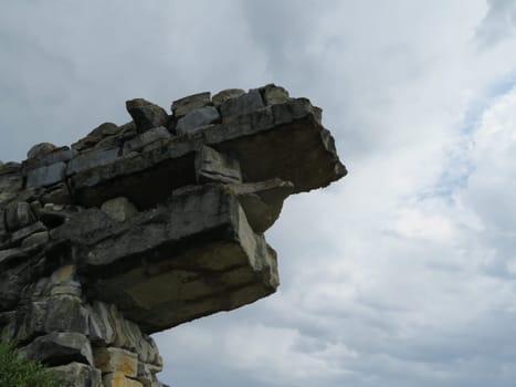 beautiful dragon-shaped stone wall coming out of the earth
