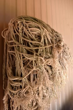An old mop sitting against a wall