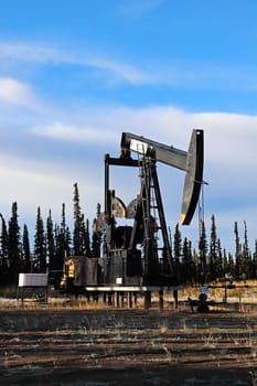 Stilled oil rigs with closed radigans signage.
