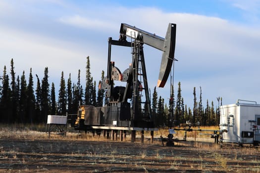 Stilled oil rigs with closed radigans signage.