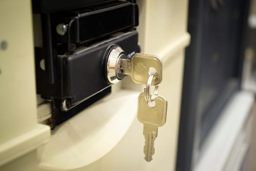 closeup deposit safe or cash box with key