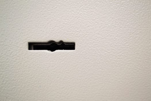 Armored front door, security lock for key. Safe keyhole closeup