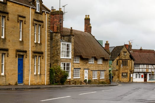 view of old houses  and downhill street in the historic village.