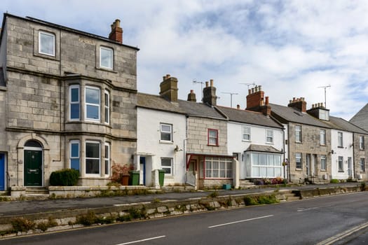 view of old houses  and downhill street in the historic village.