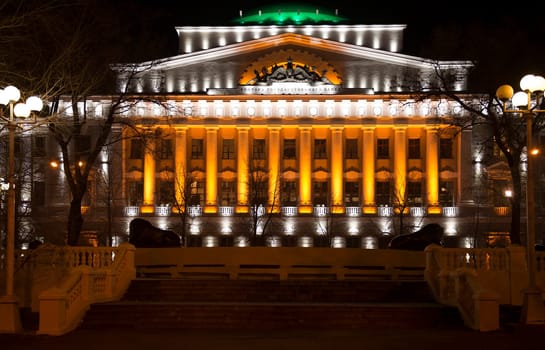 Rostov-on-Don,Russia-November 30,2013:Building the Bank of Russia lit decorative illumination.In the foreground is a statue of a lion. Near bank there are cars