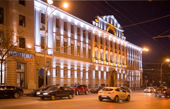 Rostov-on-Don,Russia-November 30,2013:Building the Bank of Russia lit decorative illumination.In the foreground is a statue of a lion. Near bank there are cars