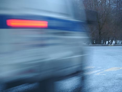Police car motion blur, red traffic lights