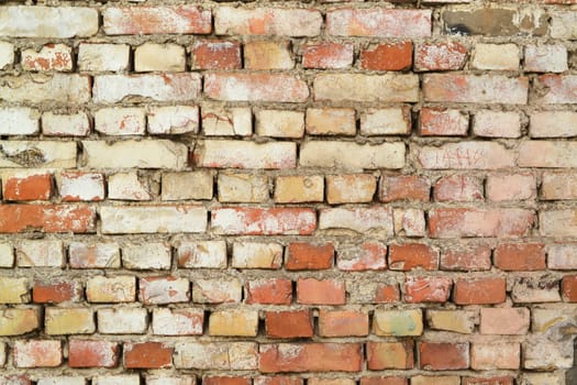 Old red brick wall in a background image, grunge texture close up