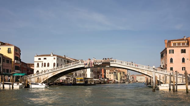 Venice, Italy- March 30, 2014: Tourists walk on the bridge Scalzi