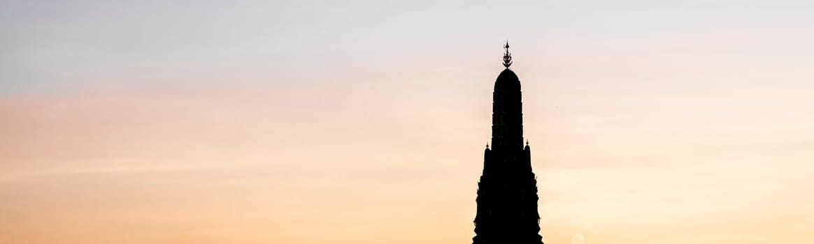 Sunset silhouette scene at Wat Arun Temple. The best place to watch sunset in Bangkok . Wat Arun Temple of the Dawn at sunset on banks of Chao Phraya River Bangkok Thailand Southeast Asia Asia