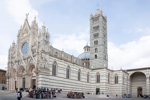 SIENA,ITALY-APRIL 01-Tourists visiting Siena Cathedral, dedicated to the Assumption of the Blessed Virgin Mary in April 01,2014 . Siena.Italy.