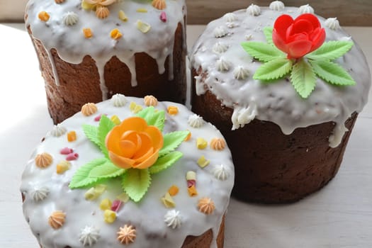 Bright Easter cakes kulich decorated with icing and colorful candy