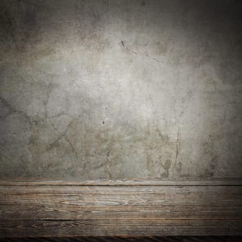 Wooden decking table on a grey grunge background. Place for an item, logo, or label. Layout, mockup.