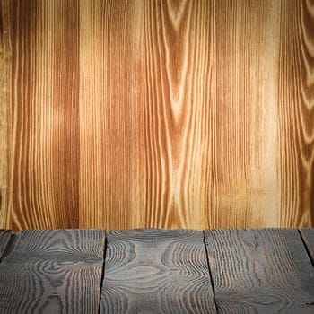 Wooden table flooring on a wooden background. Place for the product, logo, or label. Layout, layout.