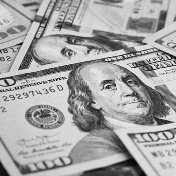 A hundred American banknotes are scattered. cash hundred-dollar bills, dollar background image.