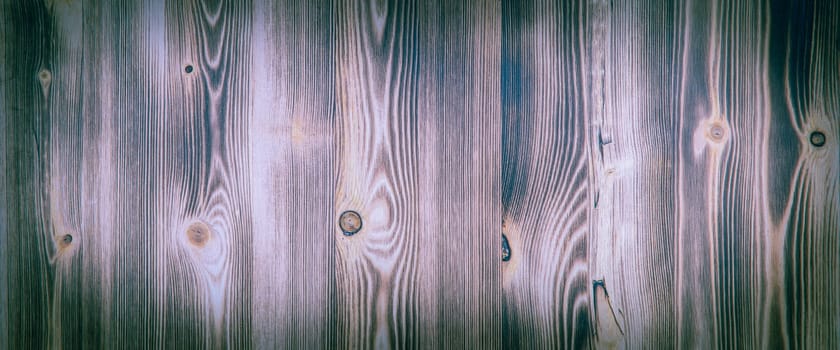 Old wooden background with purple horizontal boards. layout, space for text and logo.